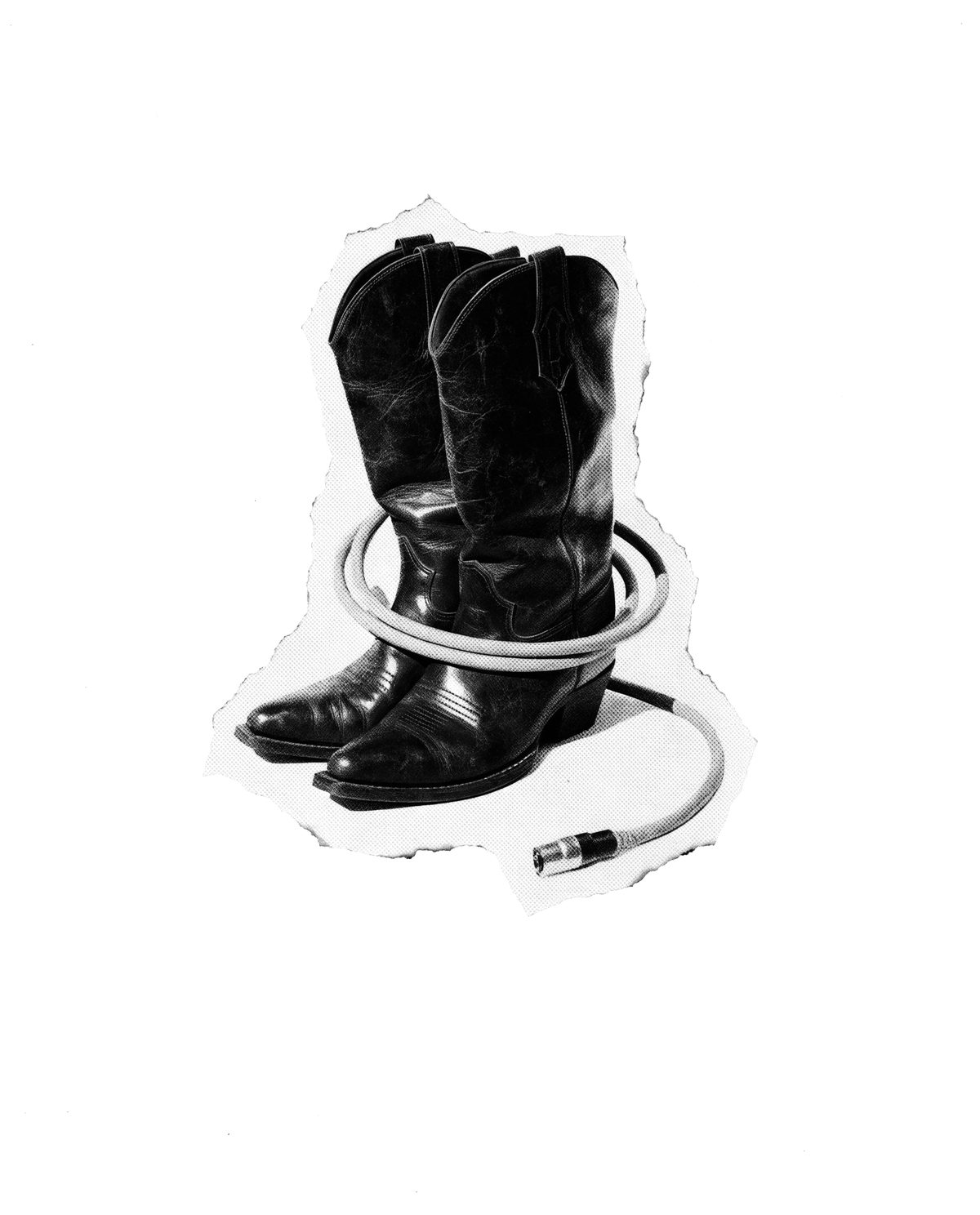 A pair of worn cowboy boots with a coiled guitar cable at their feet